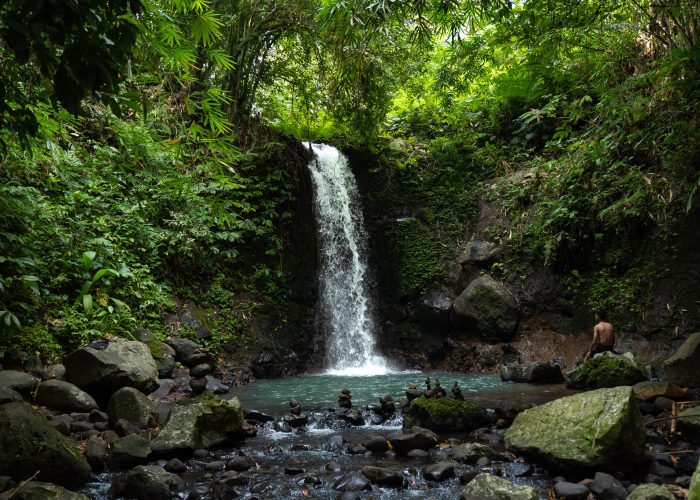 Walking Tour Bali - A waterfall while exploring the remote areas of Bali, away from the developed tourist routes.