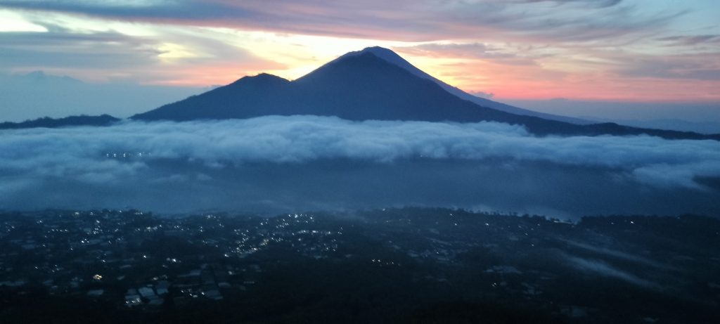 Sunrise as seen from Mount Batur UNESCO Geopark - My Agung in Silhouette 